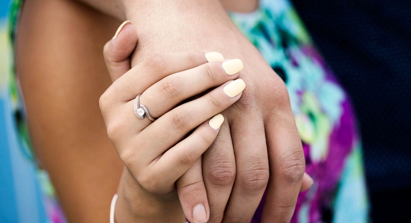 Closeup image of couple holding hands. When living with MS, bladder and bowel issues may interfere with your sex life, which can be linked to a lower quality of life. Understand the situation and possible solutions. 